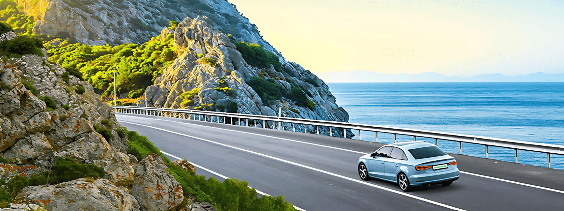 car driving along mountain road